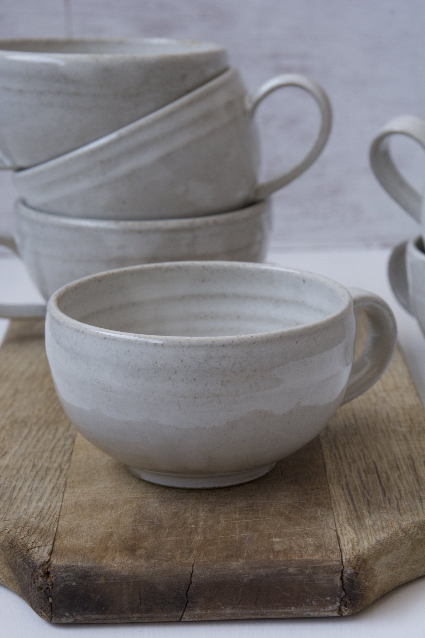 https://www.madaboutpottery.com/cdn/shop/products/hand-thrown-white-cappuccino-cup-saucer-135418.jpg?v=1669552403&width=1445