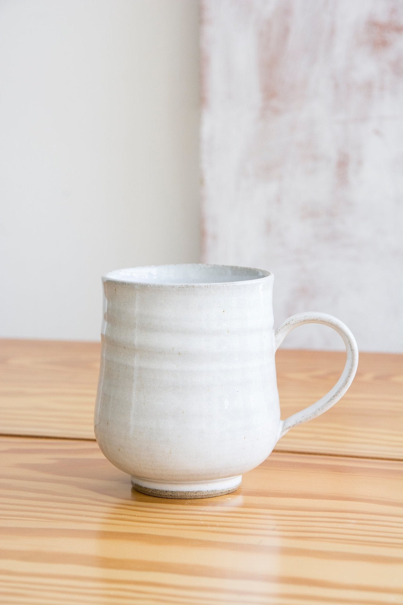 https://www.madaboutpottery.com/cdn/shop/products/set-of-6-farmhouse-white-pottery-mugs-559239.jpg?v=1669484352&width=1445