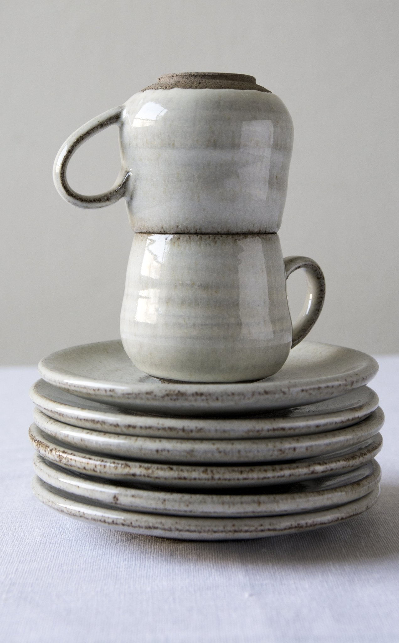 https://www.madaboutpottery.com/cdn/shop/products/set-of-6-pottery-espresso-cups-in-white-862386.jpg?v=1568380611&width=1445