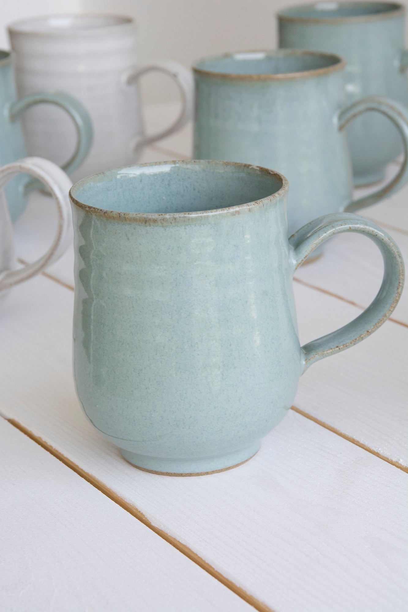 A pair of handmade mugs, white stoneware,aChun glaz5 outlet each cup holds 6 oz