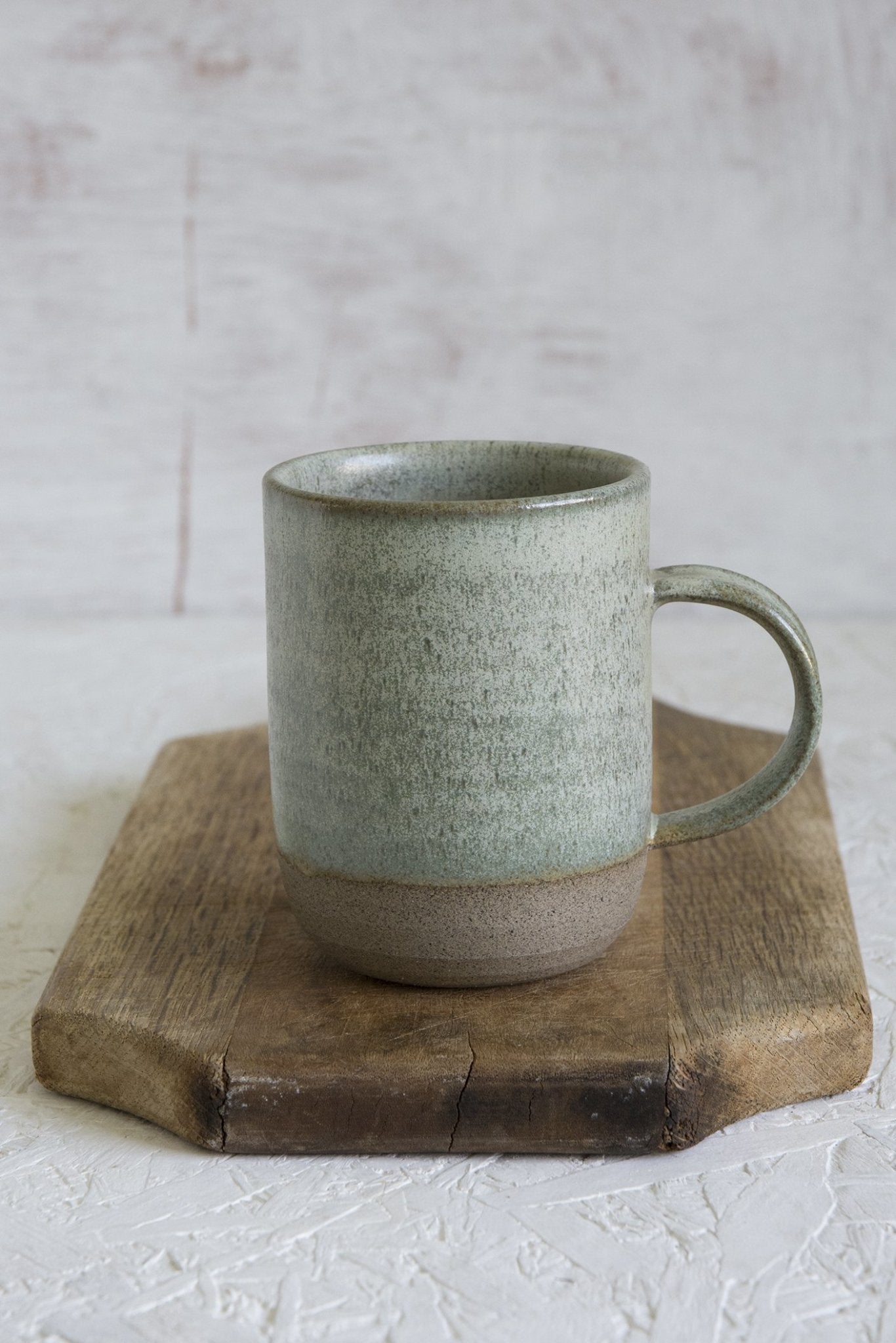 https://www.madaboutpottery.com/cdn/shop/products/tall-narrow-pottery-mug-10-fl-oz-474546.jpg?v=1664180447&width=1445