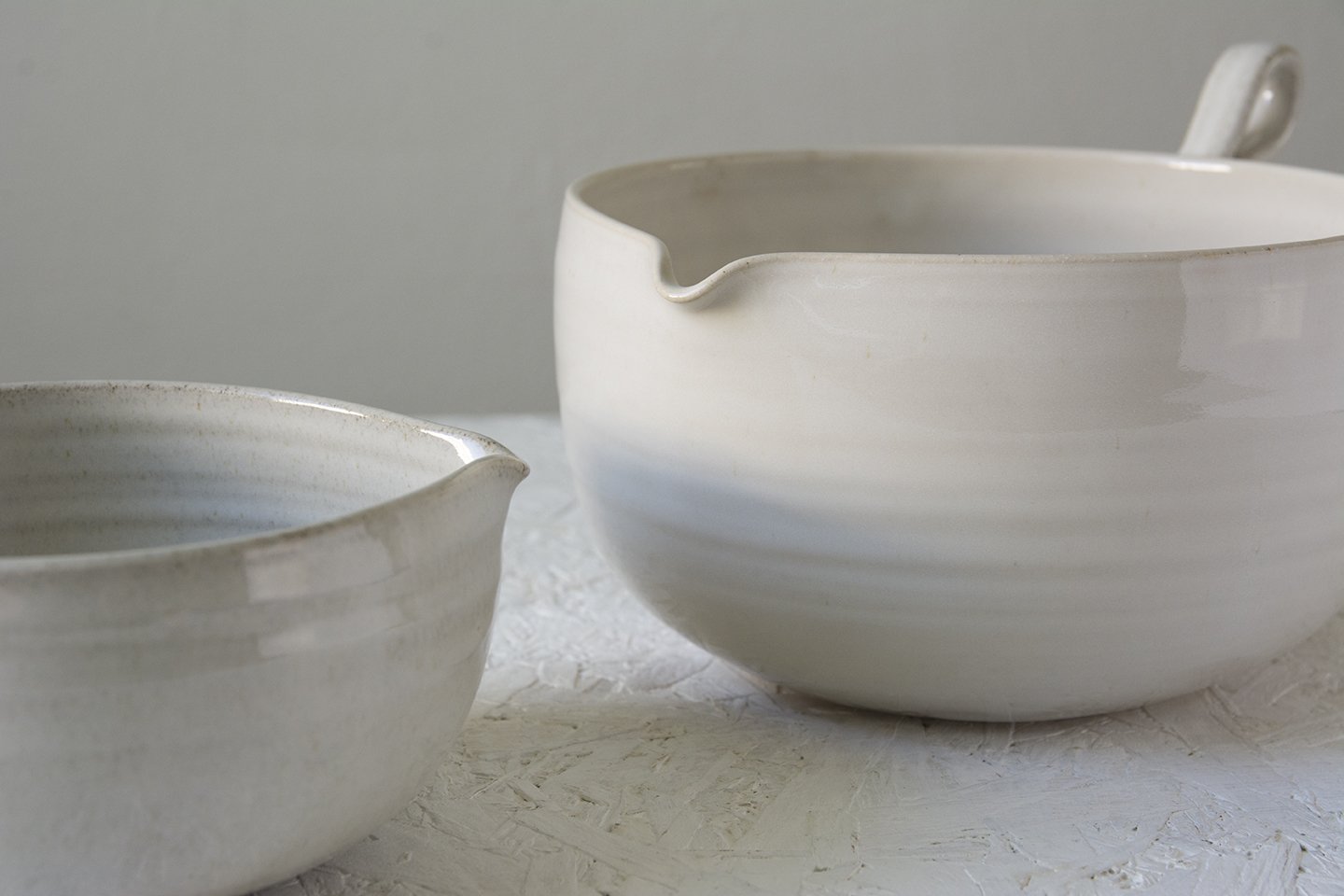 https://www.madaboutpottery.com/cdn/shop/products/white-ceramic-mixing-bowl-144172.jpg?v=1568380593&width=1445